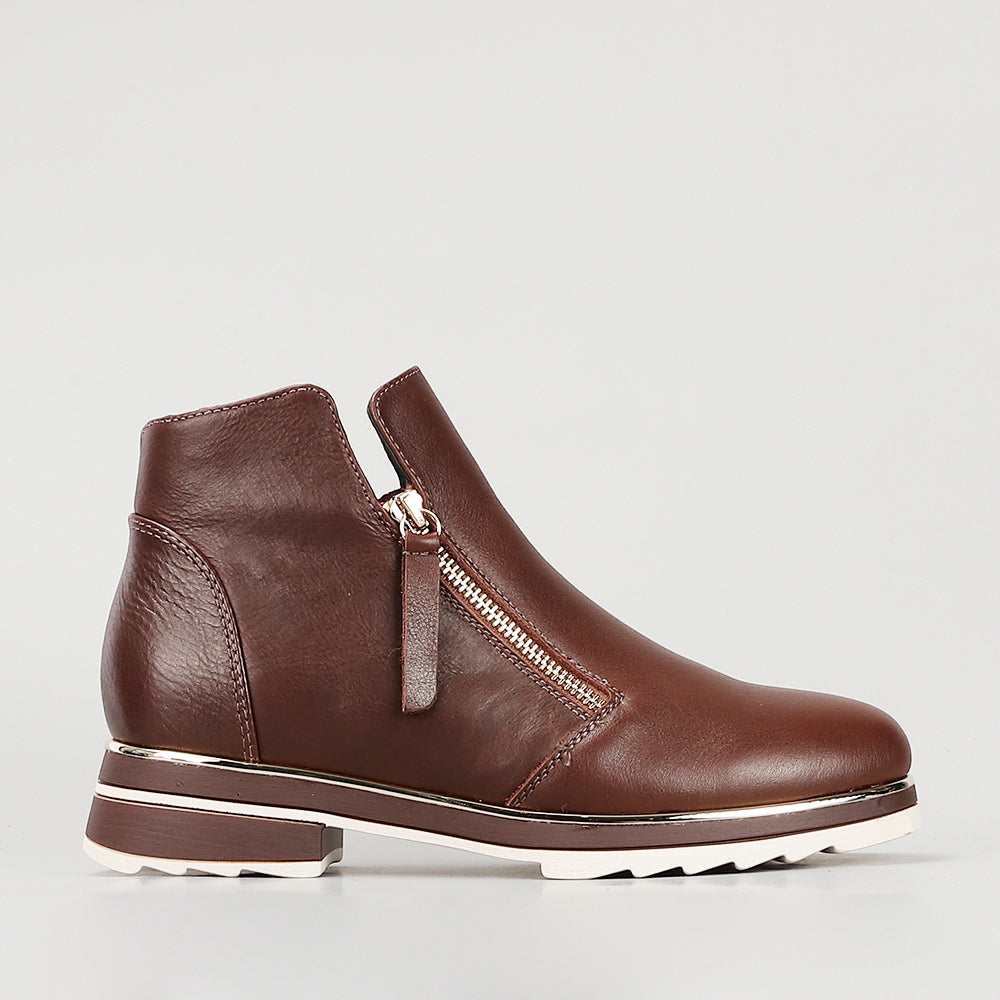 Le Sansa Basel Chocolate boots with sleek design, brown leather exterior, and stylish ankle height for a modern look.