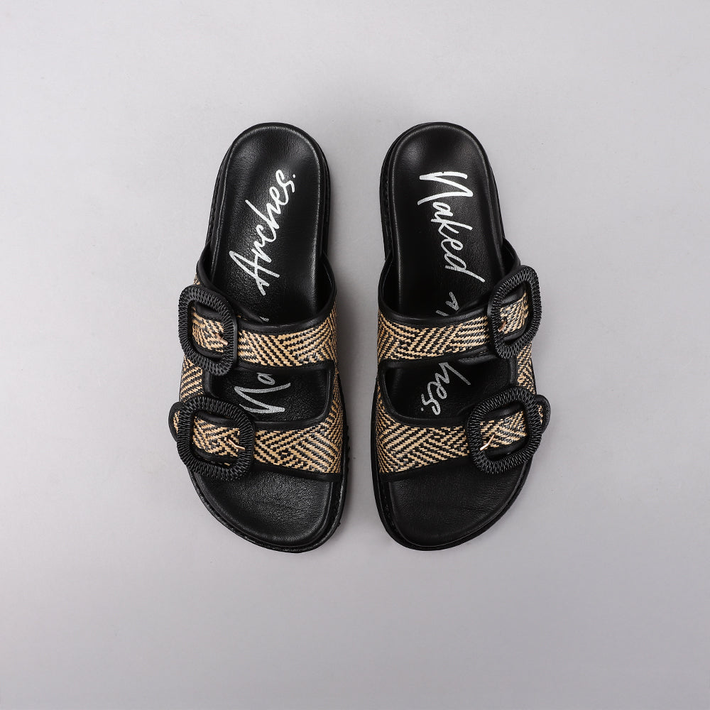 Black flats from Naked Archies Harriet collection, featuring sleek leather design with rounded toe and comfortable slip-on style.