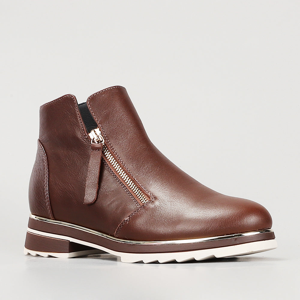 Le Sansa Basel Chocolate boots featuring a sleek design, almond toe, and stylish finish in rich chocolate brown leather.