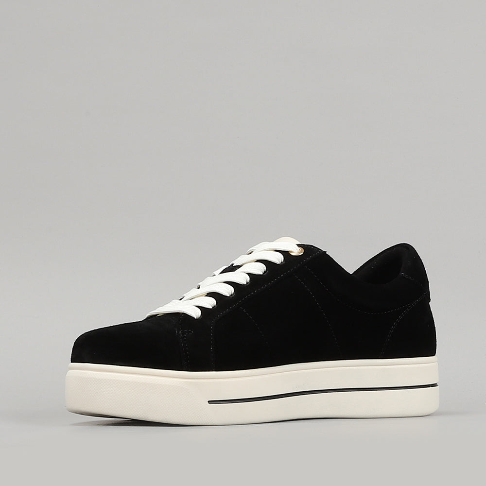 Naked Arches Azealia Black sneakers featuring black canvas and rubber soles, styled with laces and a sleek, modern design.