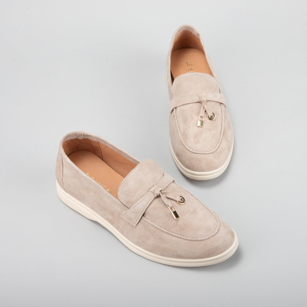 Le Sansa Capri taupe suede loafers featuring a classic slip-on design and rounded toe for casual and stylish wear.