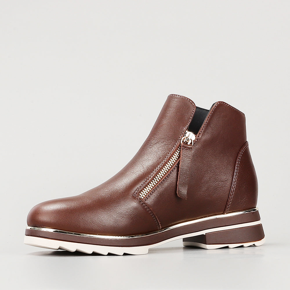 Le Sansa Basel chocolate boots with sleek black leather, rounded toe, and stylish ankle-length design.