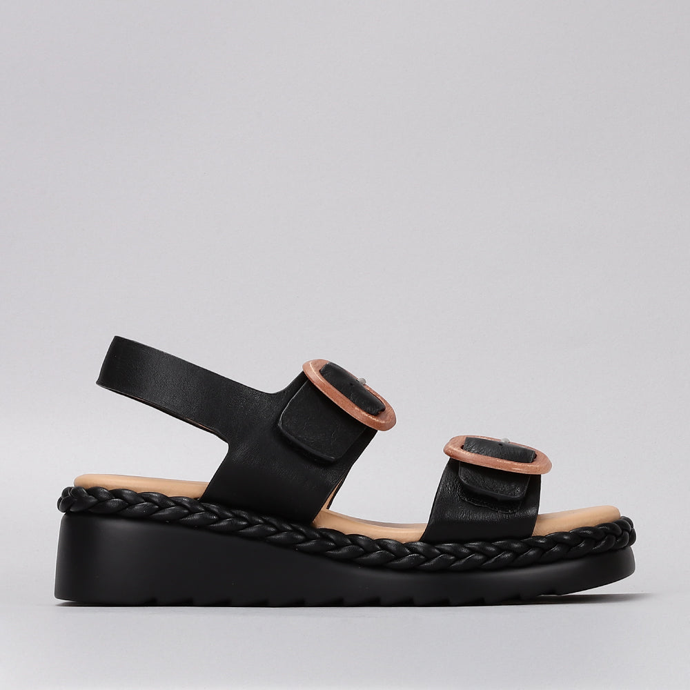 Black leather sandals from Le Sansa Sansa Emery collection featuring comfortable straps and stylish design.