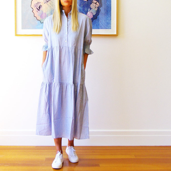 Blue and white Lottie dress by Who's Charlie, featuring a stylish, casual design perfect for warm weather.