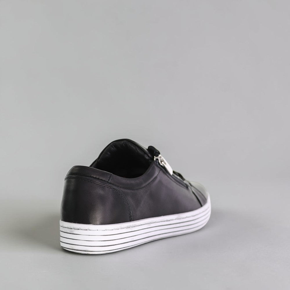 CABELLO Unity Navy sneakers with sleek navy design, white sole, and laces, showcasing casual athletic footwear style.