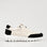 Black LE SANSA Ryder sneakers with sleek design and white sole, shown from a side view.