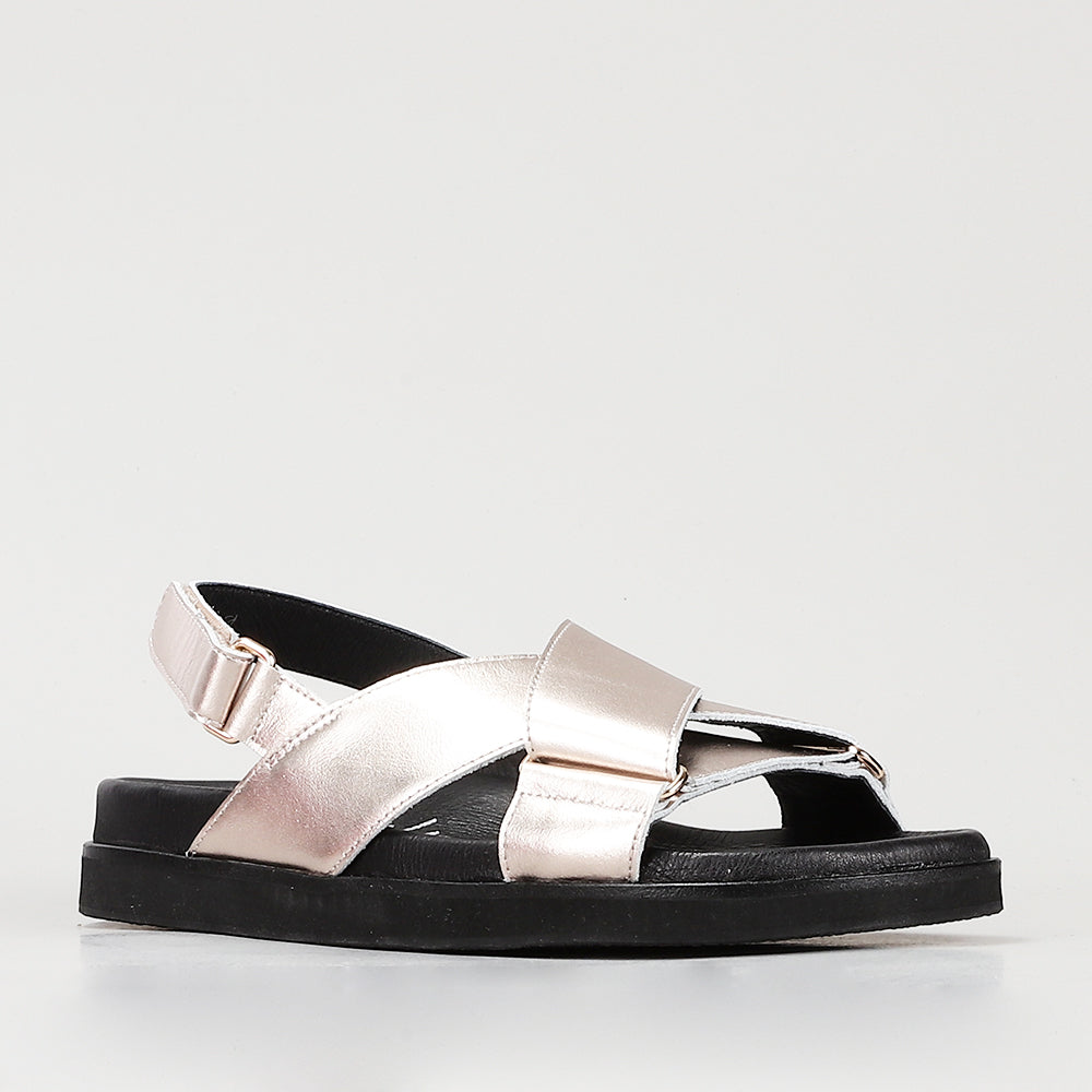 Naked Arches Marlo Champagne sandals with open-toe design and ankle strap, featuring stylish beige leather material.