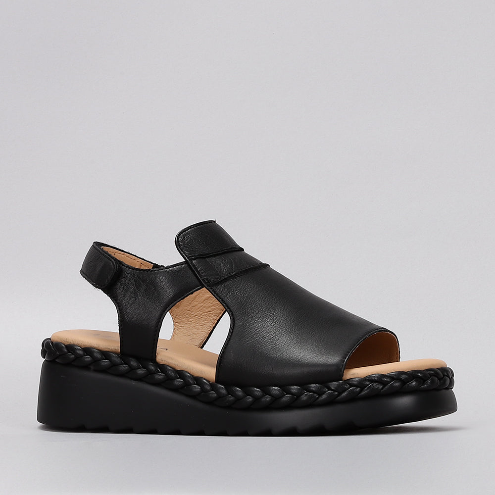 Black Le Sansa Sansa Emmeline sandals with open toes and ankle straps, showcasing sleek design and comfortable fit.