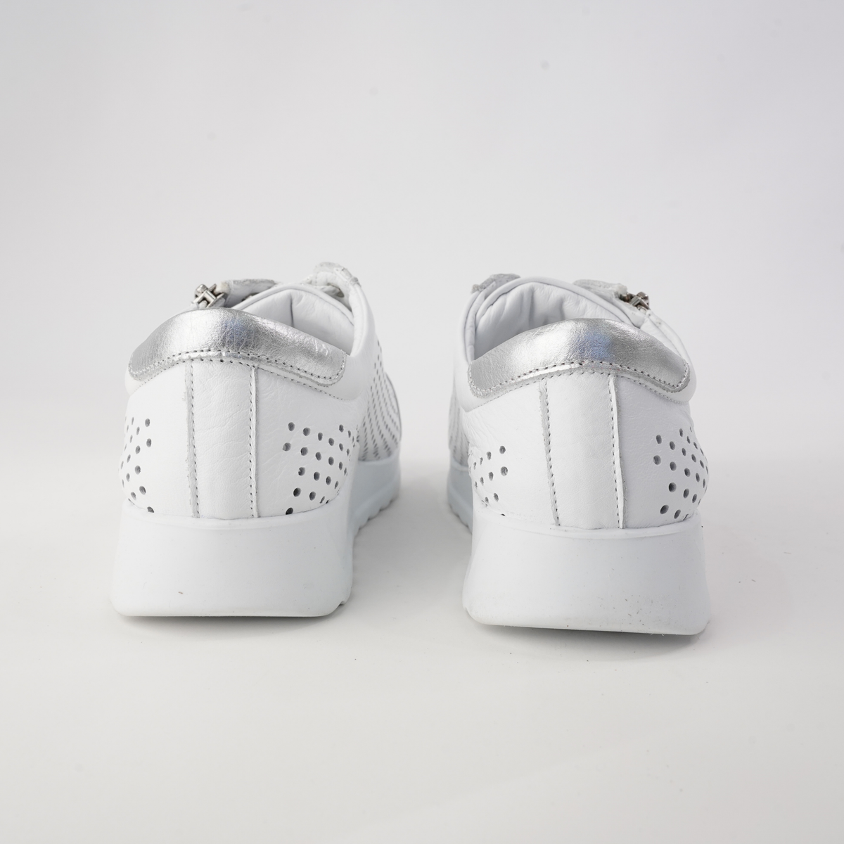 White Cabello EG256 sneakers with sleek design and comfortable fit, shown from a side angle.
