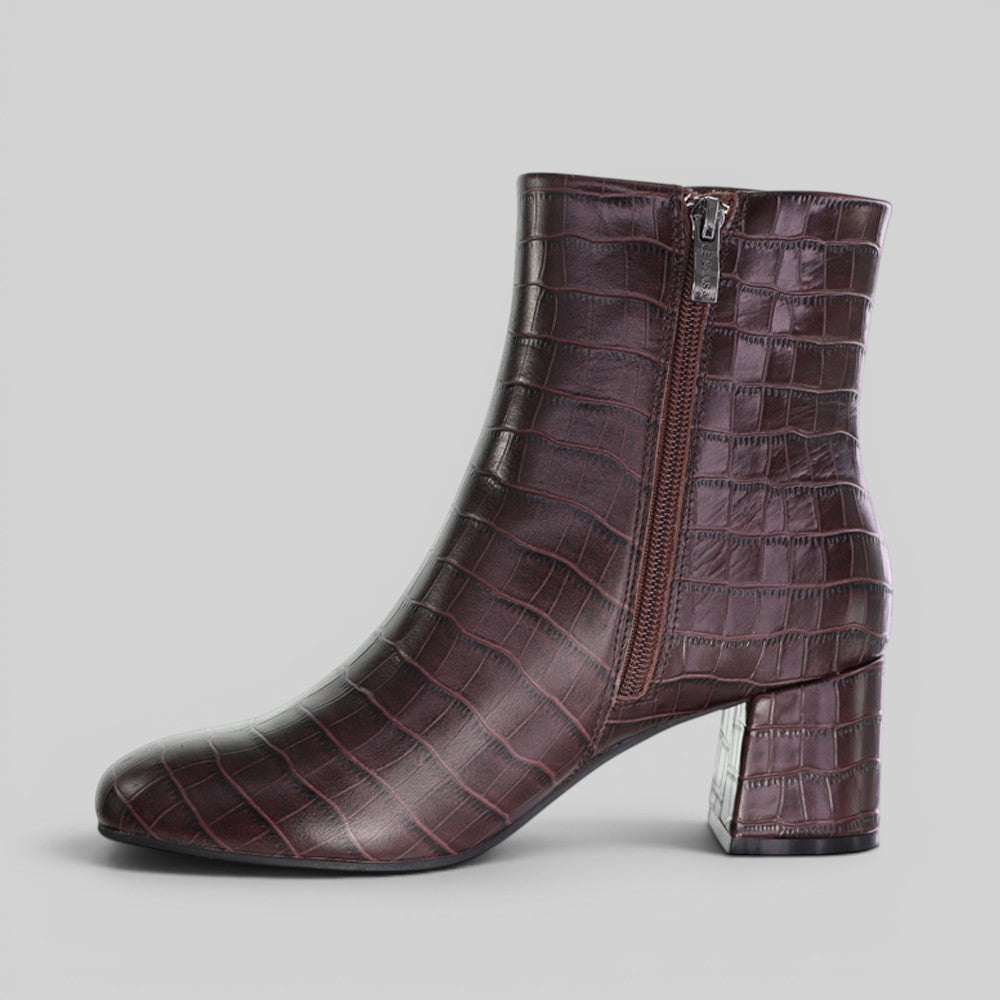 Le Sansa Rocket Chocolate Croc boots with chunky soles and slip-on design, featuring a sleek chocolate brown finish.