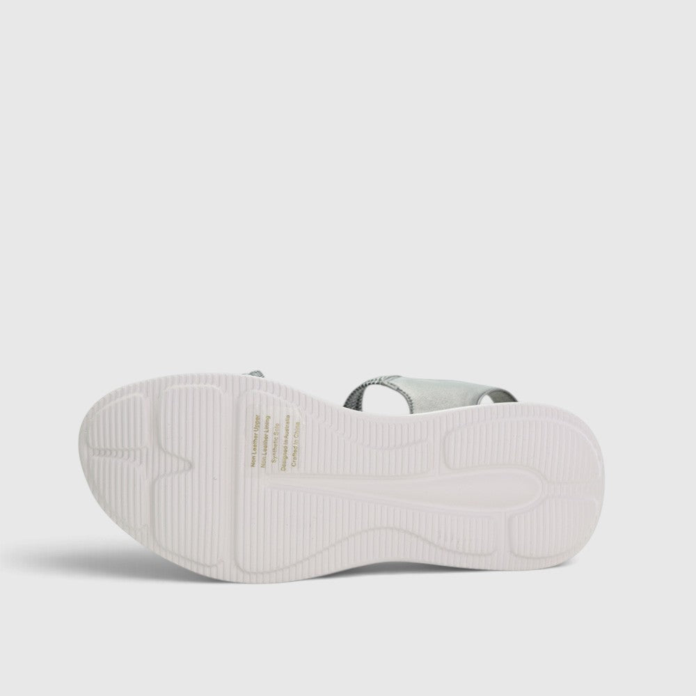 CC Resorts Florrie Pewter sandals with open toe and ankle strap, featuring metallic pewter finish and comfortable flat sole.