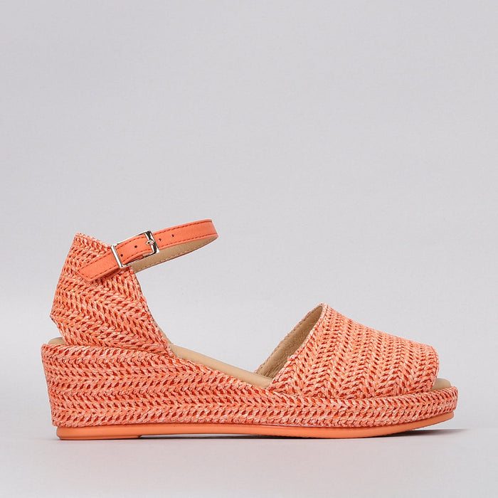 Le Sansa Pandora Orange sandals with open toes and straps, featuring a vibrant orange color and comfortable design.