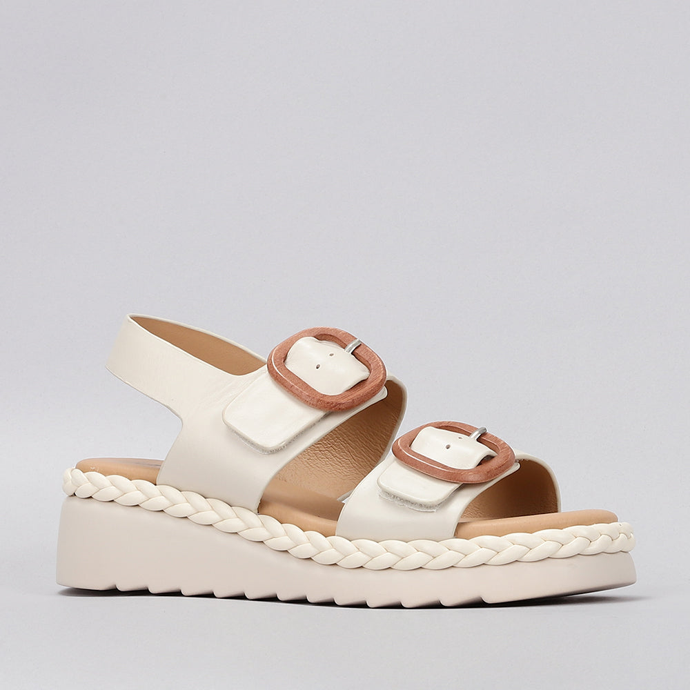 Le Sansa Sansa Emery Bone sandals featuring open toes and ankle straps, stylish and comfortable for casual wear.