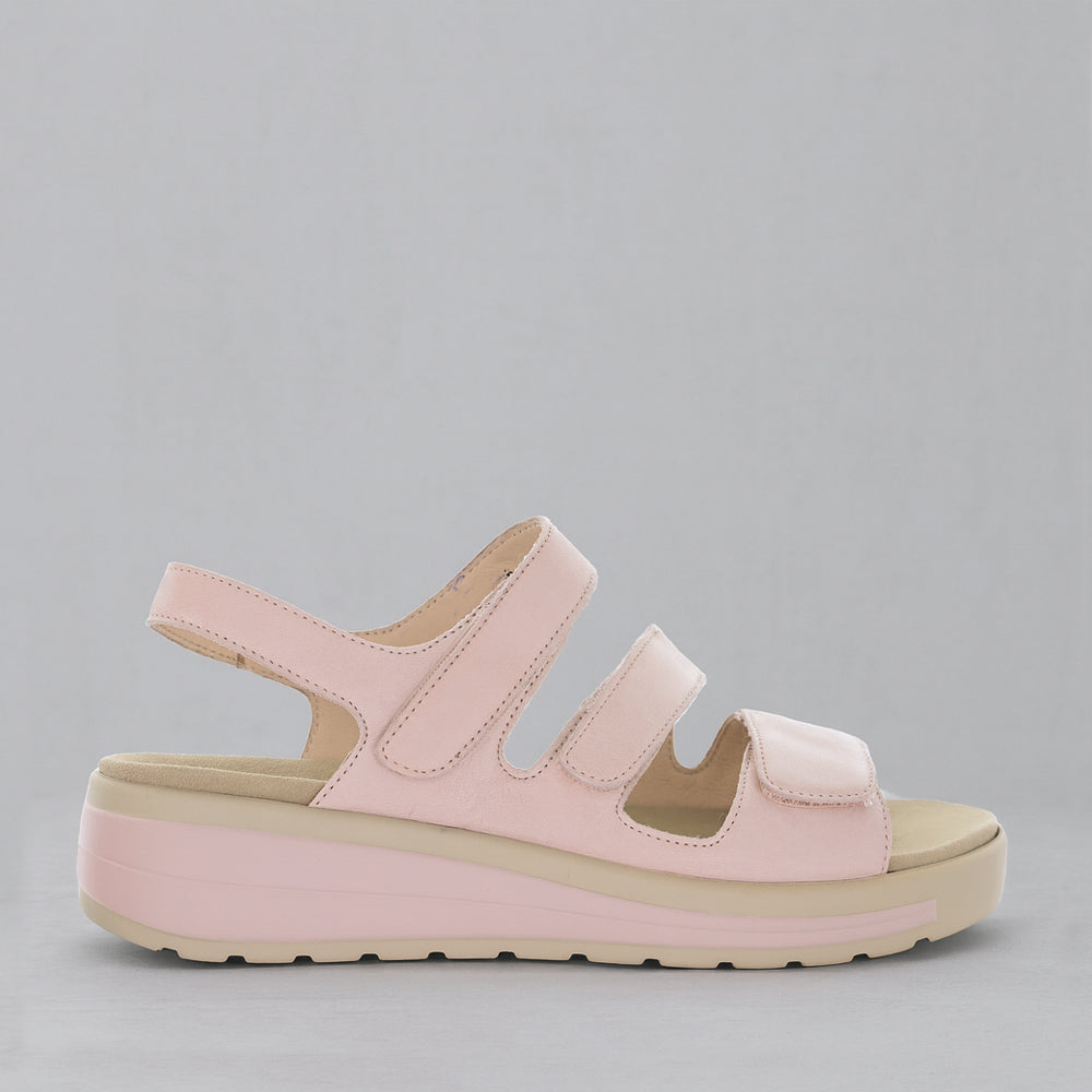 NAKED ARCHES Holiday Blush sandals featuring tan straps and cushioned footbed, perfect for casual summer wear.