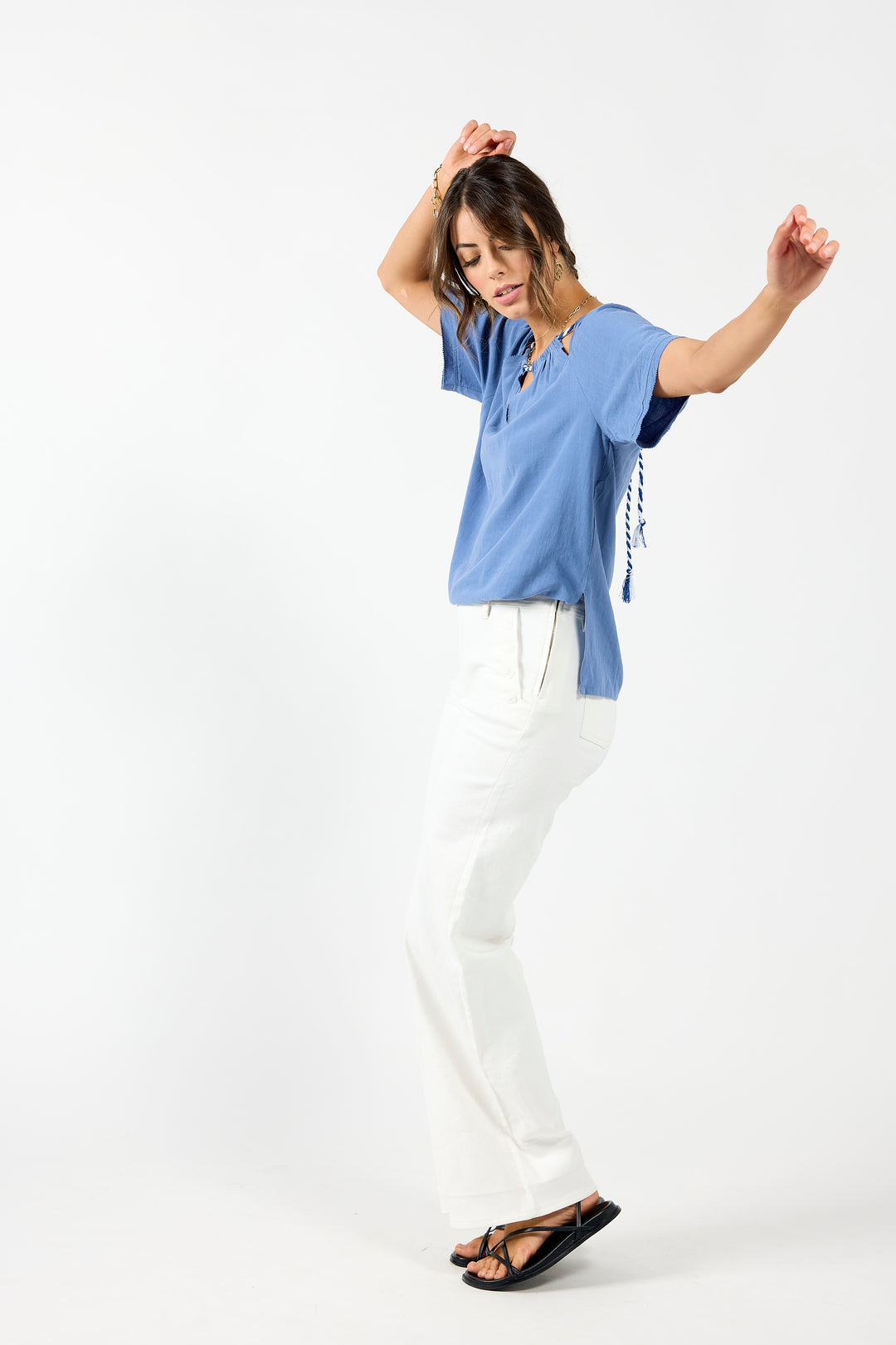 Off-white sailor jeans from Drama The Label featuring a relaxed fit and classic design, shown on a model.