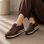 Le Sansa Skippa Chocolate sneakers featuring a sleek design and chocolate-colored upper with white sole detail.