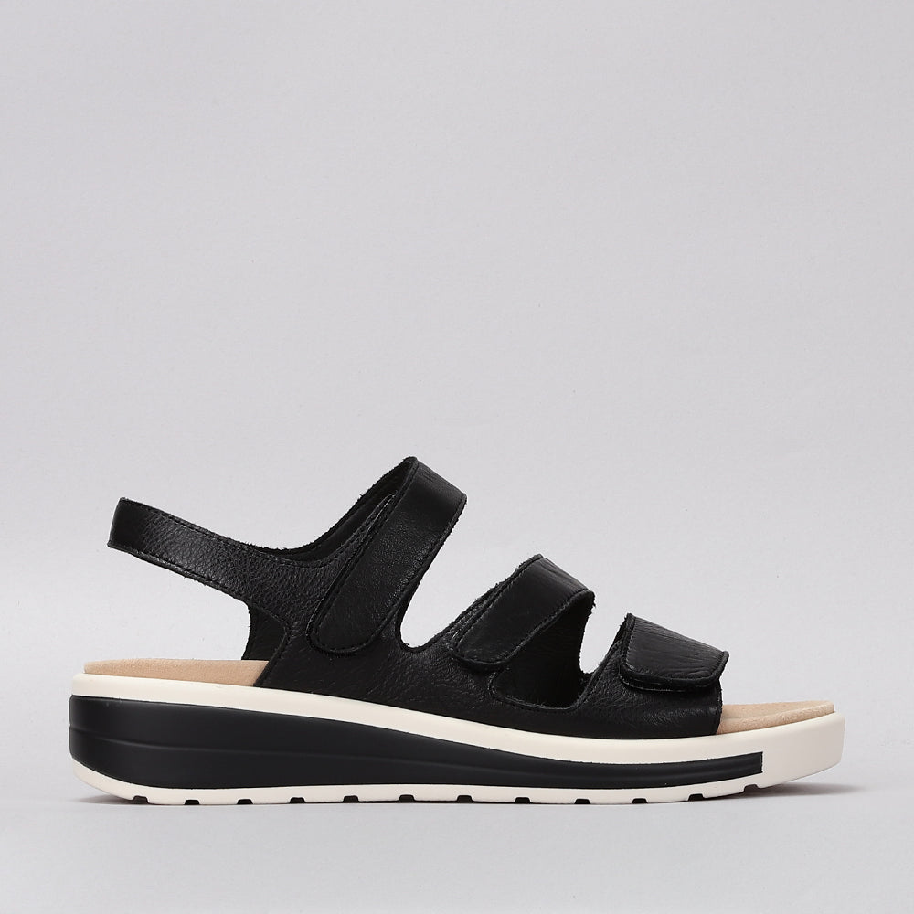 Naked Arches Holiday Black sandals with sleek black straps and cushioned footbed, stylish and comfortable footwear for warm weather.