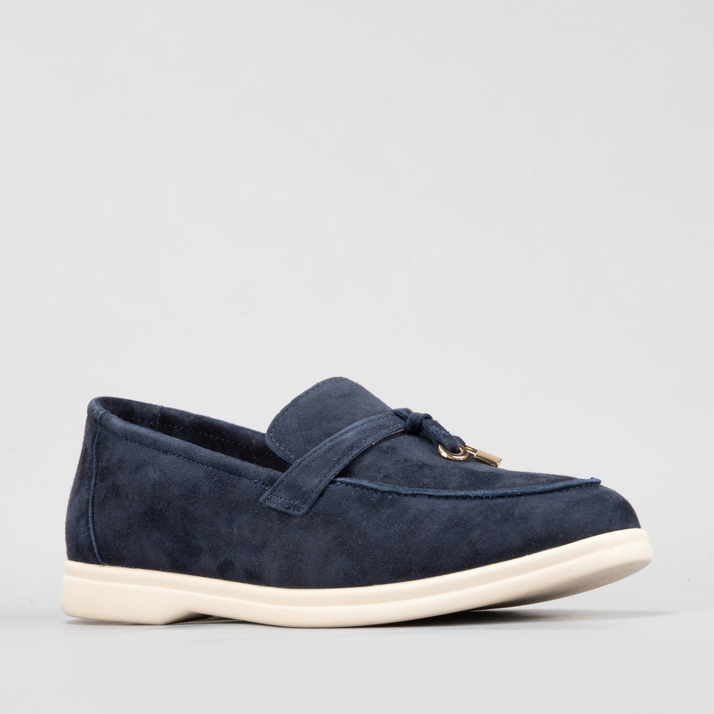 Le Sansa Capri navy suede loafers with a sleek design and comfortable slip-on style, shown in a close-up image.