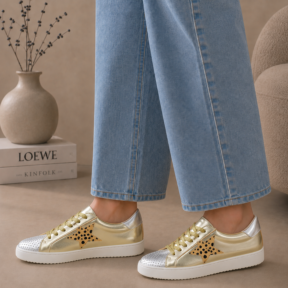 ALFIE & EVIE Valdo gold and silver sneakers with stylish design and lace-up closure, displayed on a white background.