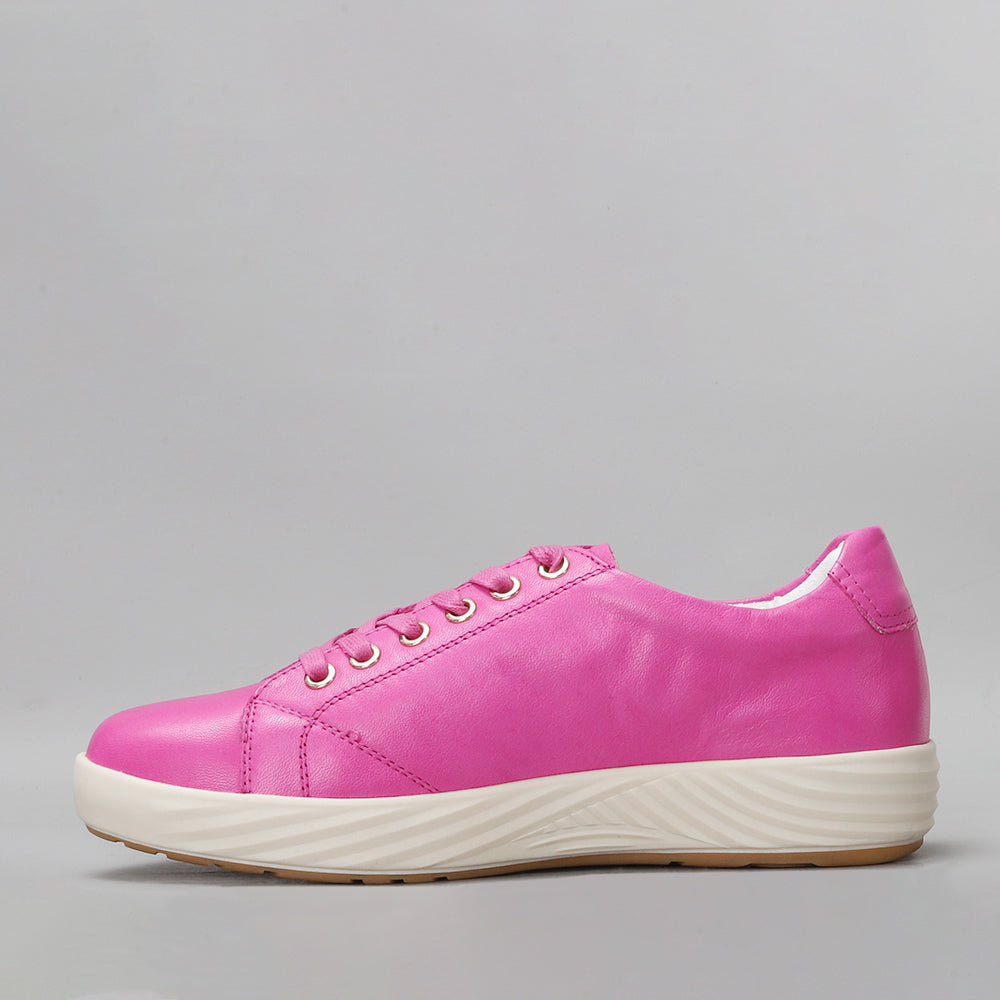 Pink Naked Arches Aliá sneakers with sleek design and cushioned soles, shown from a side view.