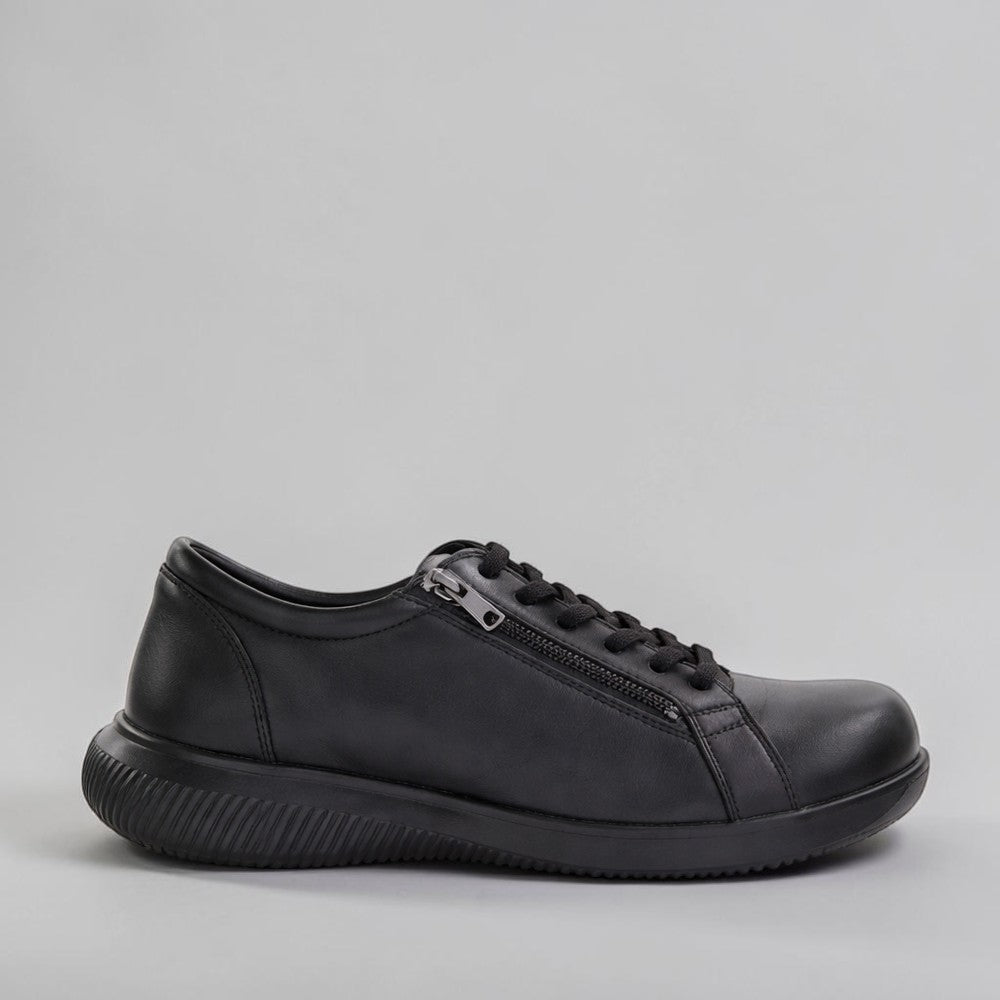 Naked Arches Avi Black sneakers with black and white design, showcasing sleek athletic footwear for casual wear.