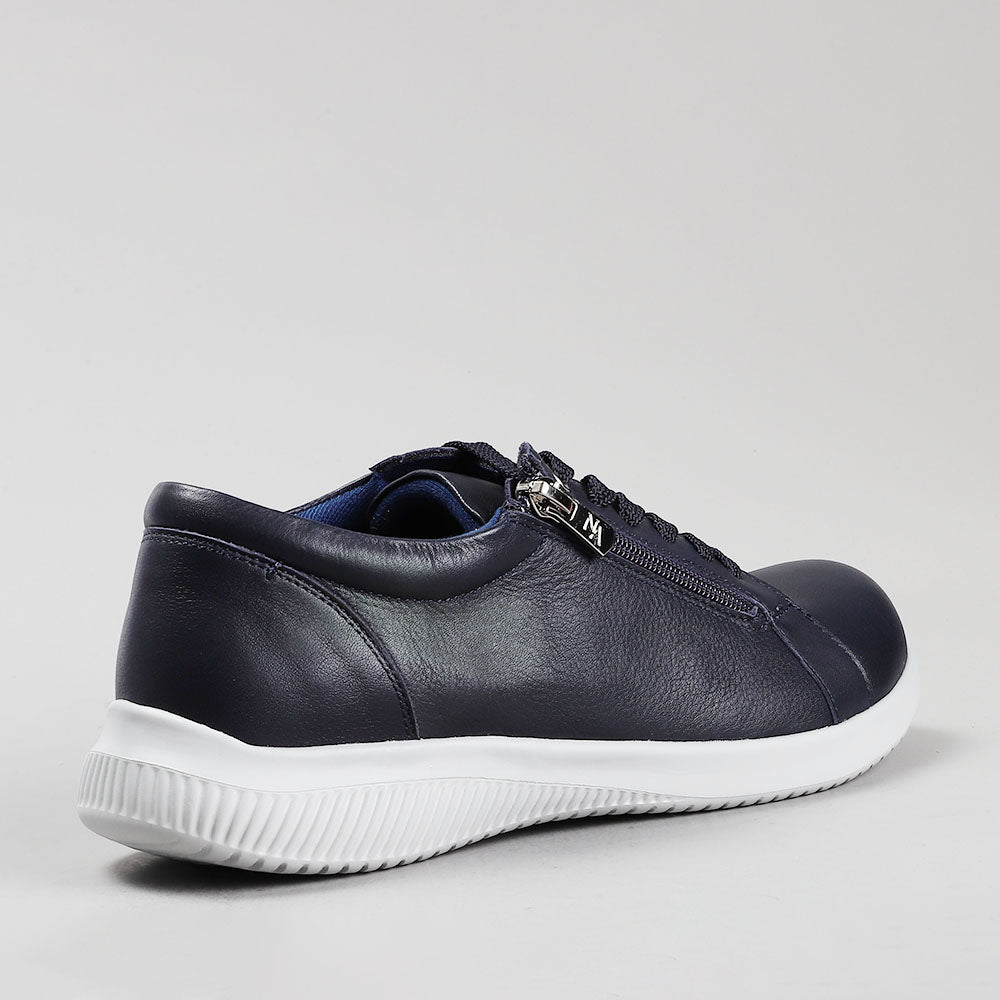 Naked Arches Avi Navy sneakers with navy blue and white design, featuring sporty laces and stylish casual footwear for men and women.