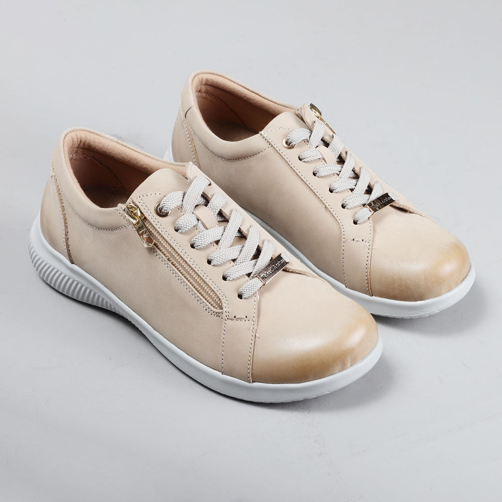 Naked Arches Avi Taupe sneakers featuring a sleek taupe design with white soles and stylish laces.
