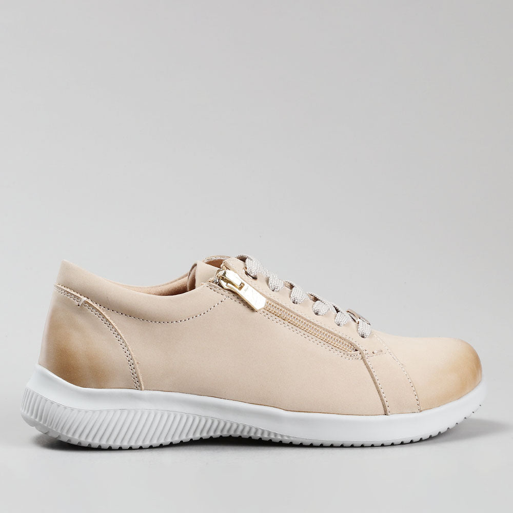 Naked Arches Avi Taupe sneakers with beige and taupe color blocking, casual slip-on style, and comfortable design.