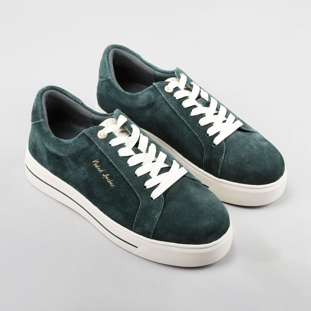 NAKED ARCHES Azealia DK Green sneakers with suede uppers and white soles, showcasing stylish, casual footwear.