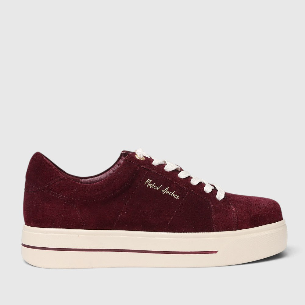 Naked Arches Azealia Burgundy sneakers showing side view with burgundy color and stylish design.