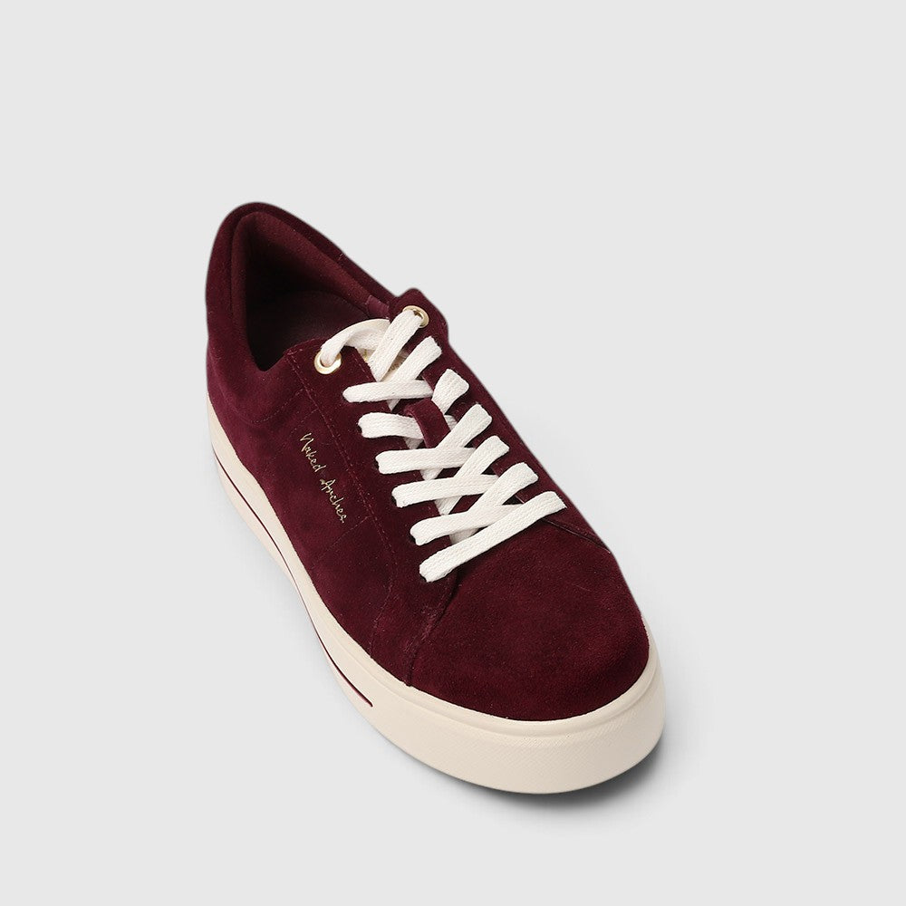 Pink and burgundy NAKED ARCHES Azealia sneakers with white soles and stylish design, shown from a top view.