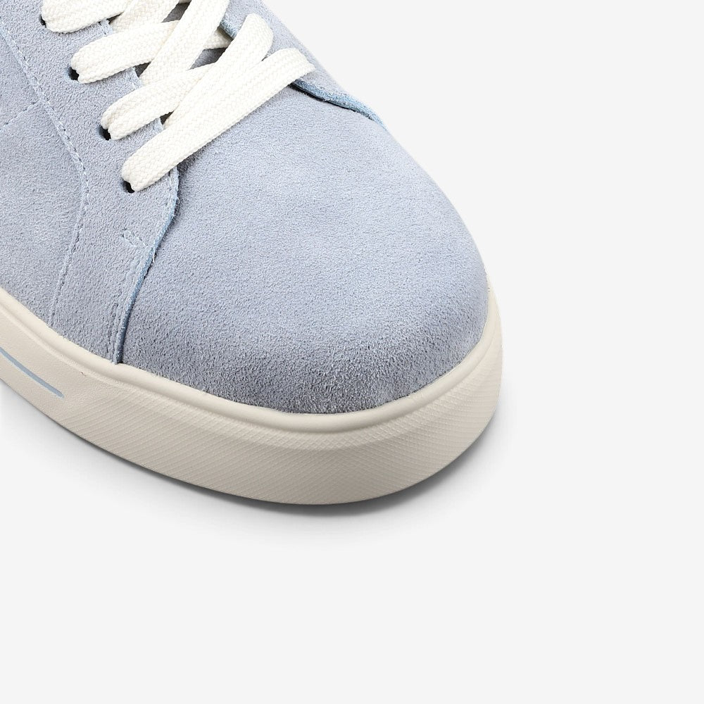 Close-up of Naked Arches Azealia denim sneakers showing blue denim material and stylish design details.