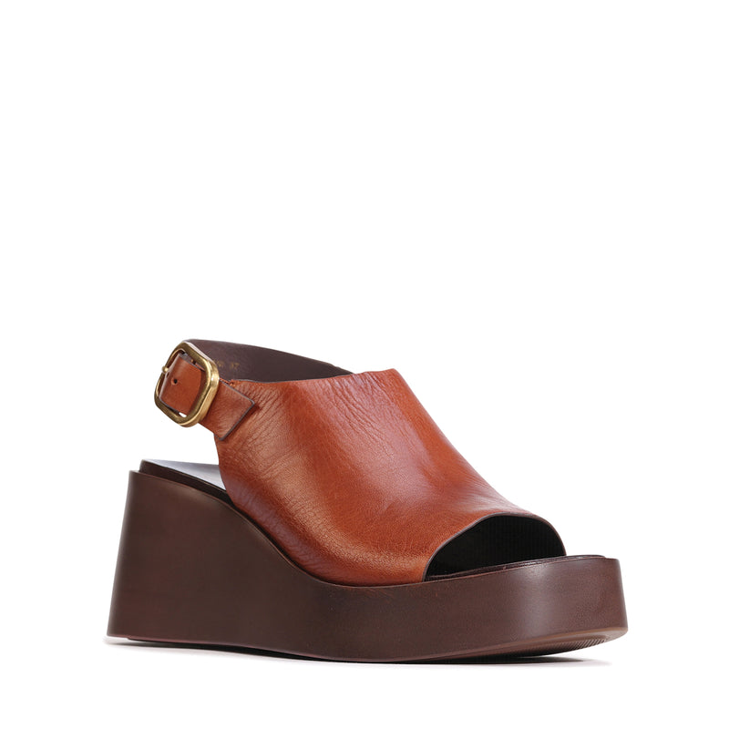 Eos Ariani Brandy sandals featuring stylish straps and a comfortable flat sole, perfect for casual summer wear.