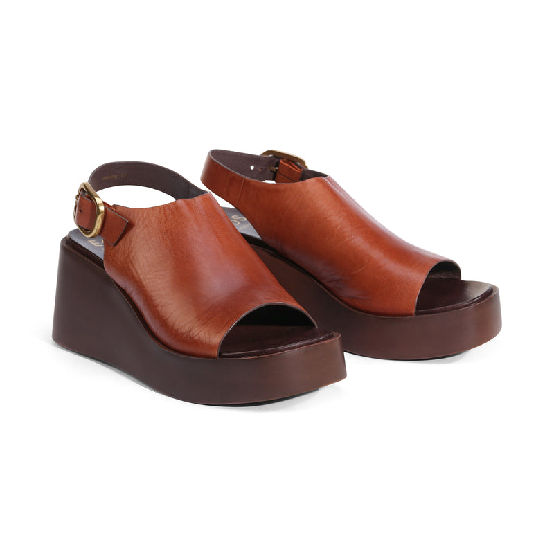 Eos Ariani Brandy sandals featuring a stylish open-toe design with sleek straps and a comfortable flat sole.