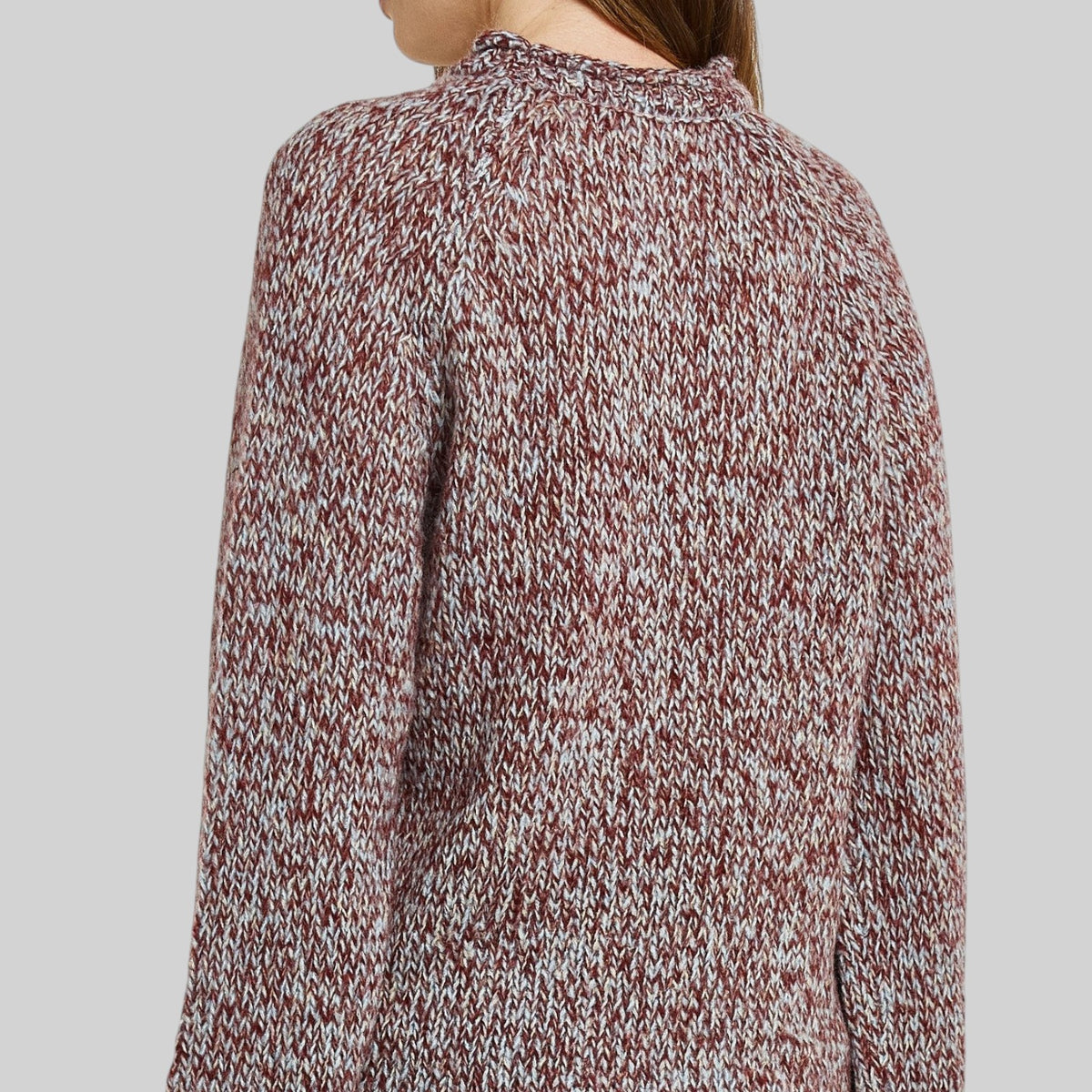 Betty Basics Gracie Multi Red Sweater shown on a hanger with a cozy, stylish design perfect for casual wear.