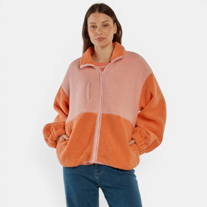 Betty Basics Jayne fleece jacket in pink-orange color, shown on a hanger with a cozy, soft fabric and stylish design.