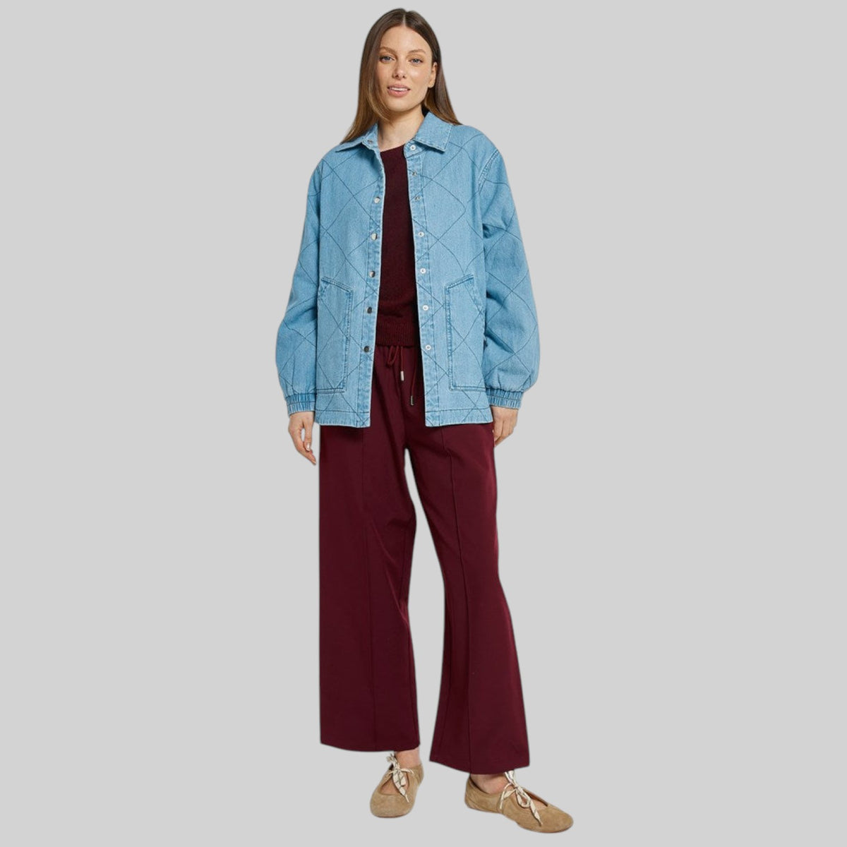 Betty Basics Quest Quilted Jacket in blue wash with a stylish quilted design, shown on a hanger.