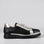 Black and gold LE SANSA Beagle sneakers with stylish design and comfortable fit, featuring the LE SANSA brand logo.
