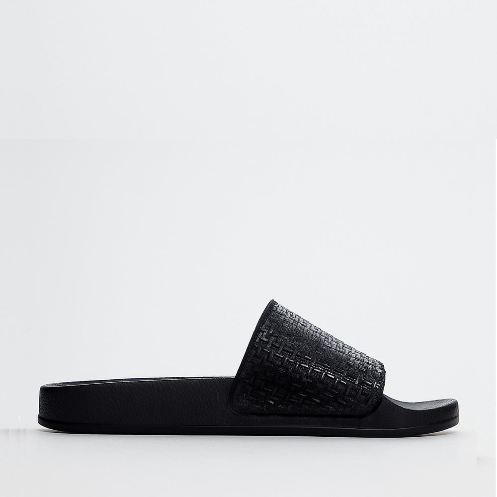 Black ALFIE & EVIE Billie slip-on shoes with sleek design and comfortable fit, perfect for casual wear.