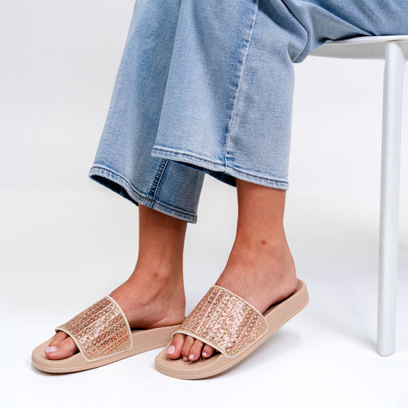 ALFIE & EVIE Billie Nude slip-ons with a sleek, minimalist design and neutral beige color, displayed on a white background.