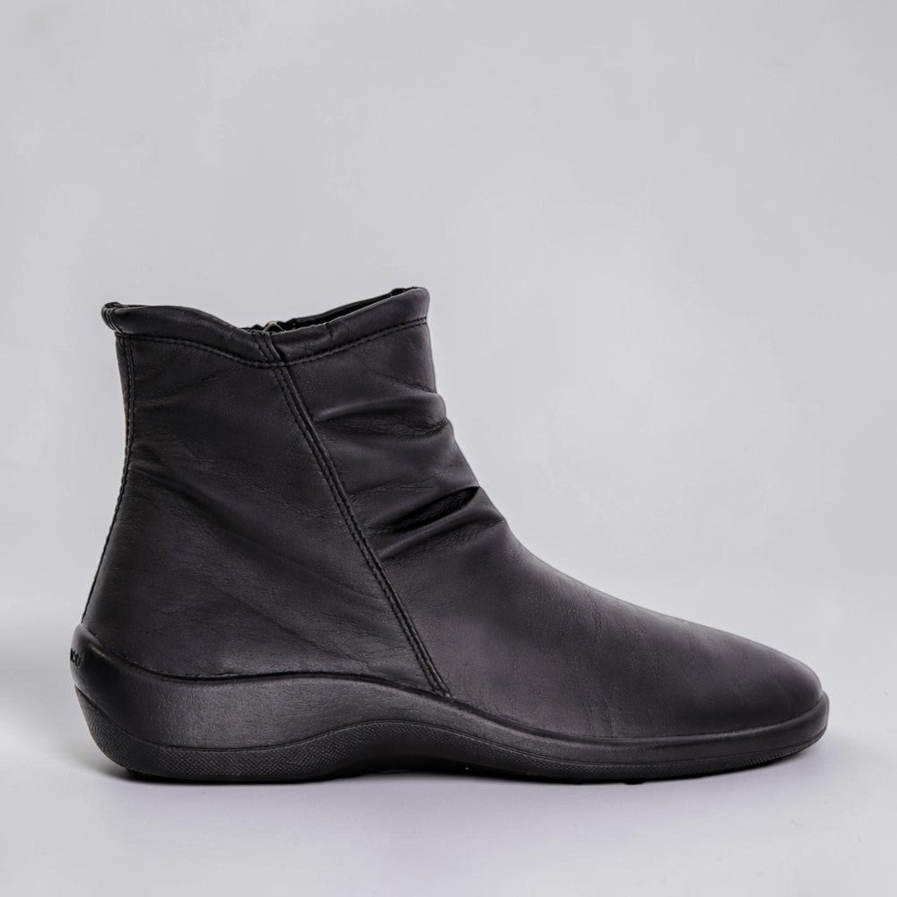 Black Arcopedico Paluma boots with a sleek design, showcasing the comfortable slip-on style and smooth leather finish.