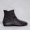 Black Arcopedico Paluma boots with a sleek design, showcasing the comfortable slip-on style and smooth leather finish.