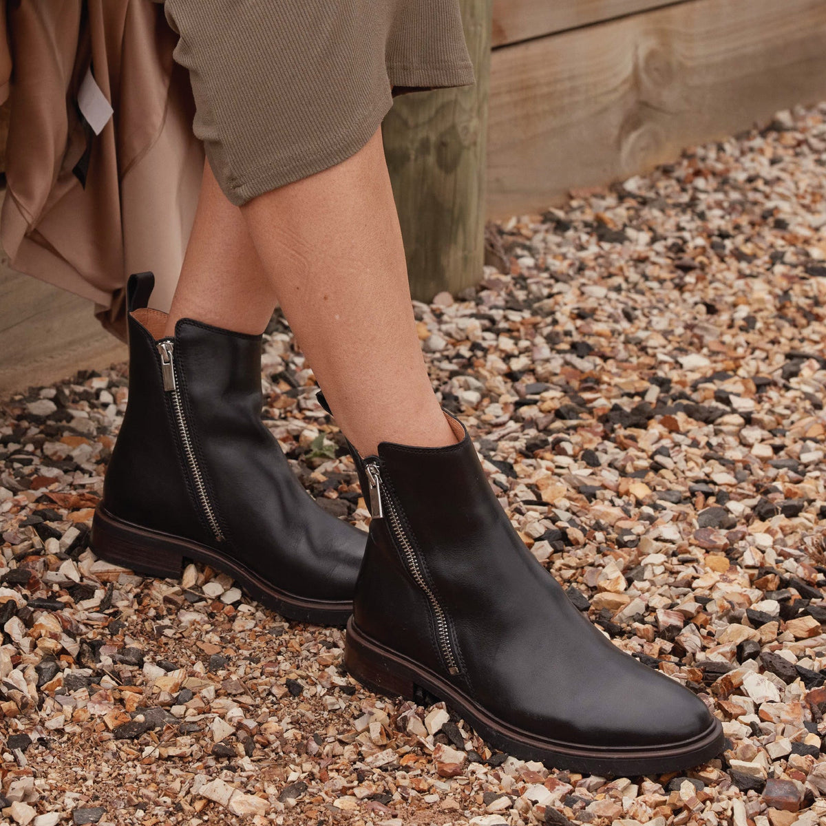 Eos Blaine Black boots featuring sleek black leather design with lace-up front and stylish ankle height.