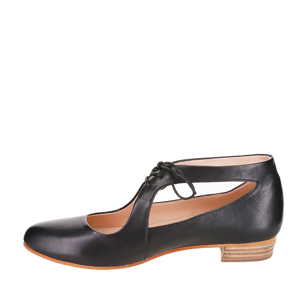 Le Sansa Boss Black sandals featuring sleek black straps and comfortable flat soles for stylish everyday wear.