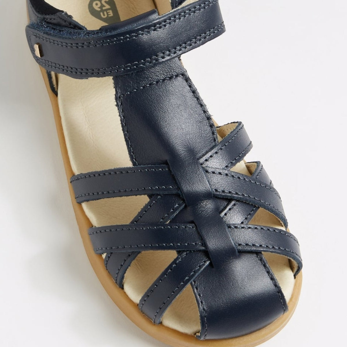 Baby Bobux Cross Jump Navy sandals with navy straps and open toe design, suitable for young children and toddlers.