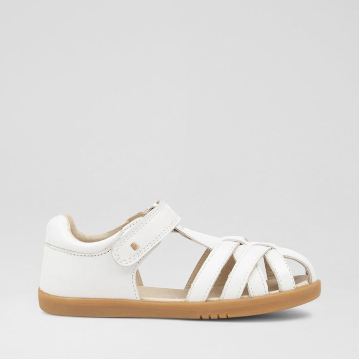 Baby Bobux Cross Jump white sandals with adjustable straps and cushioned soles, designed for comfort and style for little feet.