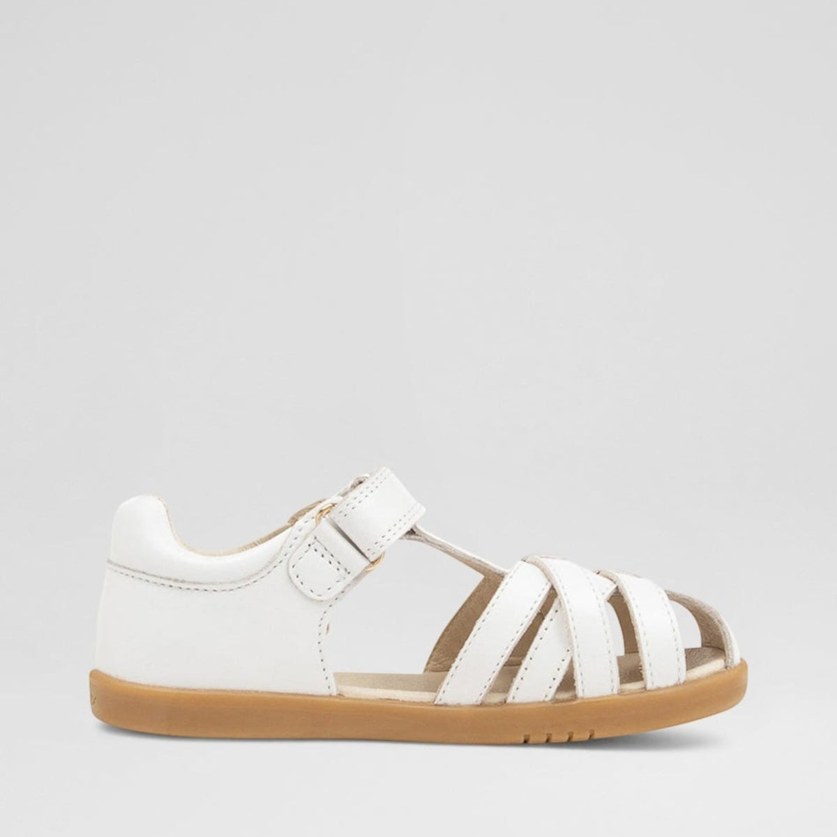 White Bobux Cross Jump baby sandals with adjustable straps and cushioned soles, perfect for comfortable little feet.