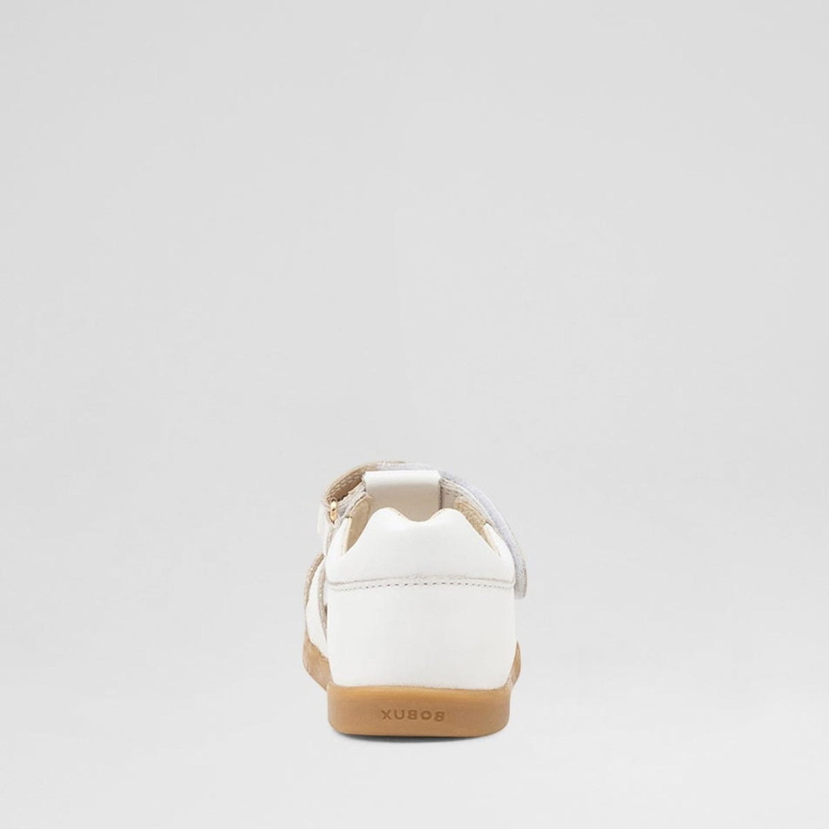 Baby Bobux Cross Jump white sandals with adjustable straps and soft soles, designed for comfortable toddler footwear.