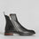EOS Blaine black boots shown outdoors, featuring sleek leather design and sturdy sole for stylish, versatile footwear.