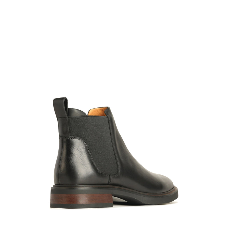 EOS Blaiz black boots shown from the back angle, featuring sleek design and stylish ankle height.